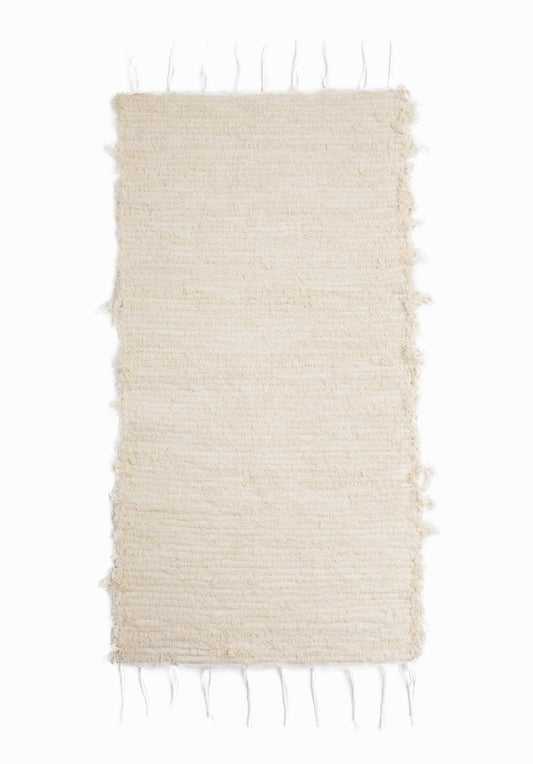 Anais, Rug